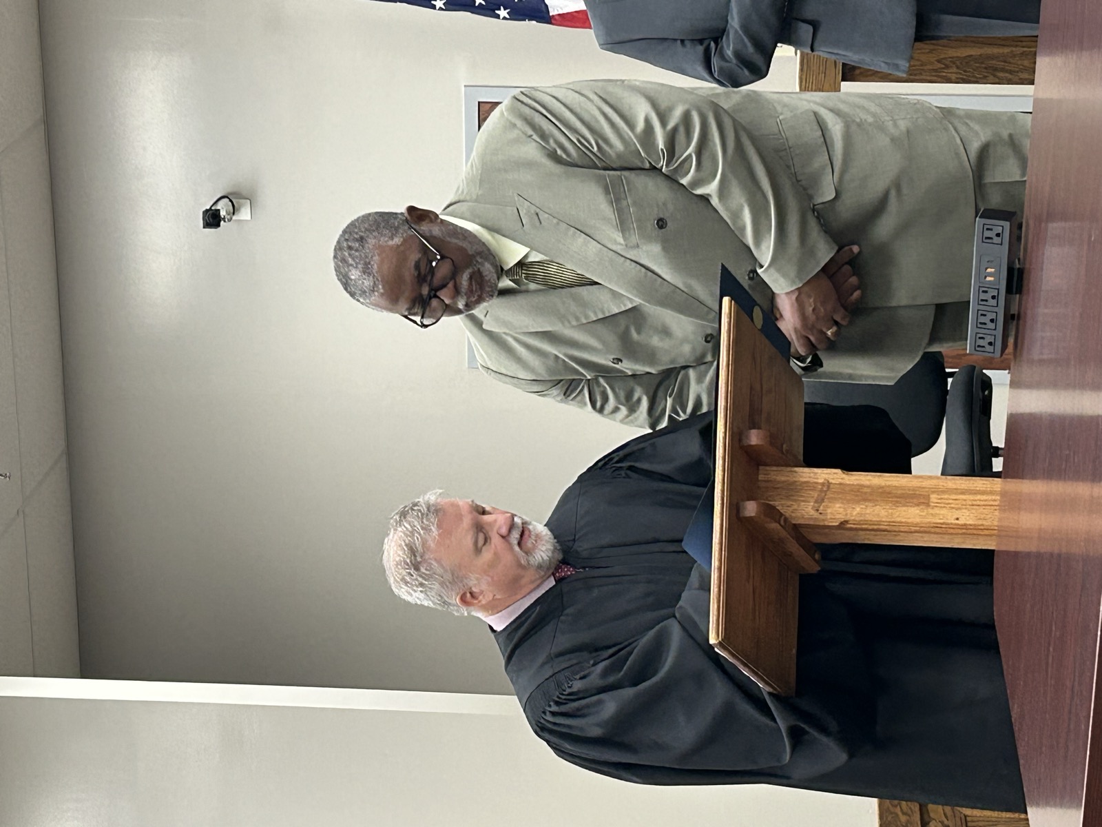 Judge Eckel presenting a certificate of appointment to a founding Veterans Court Board member