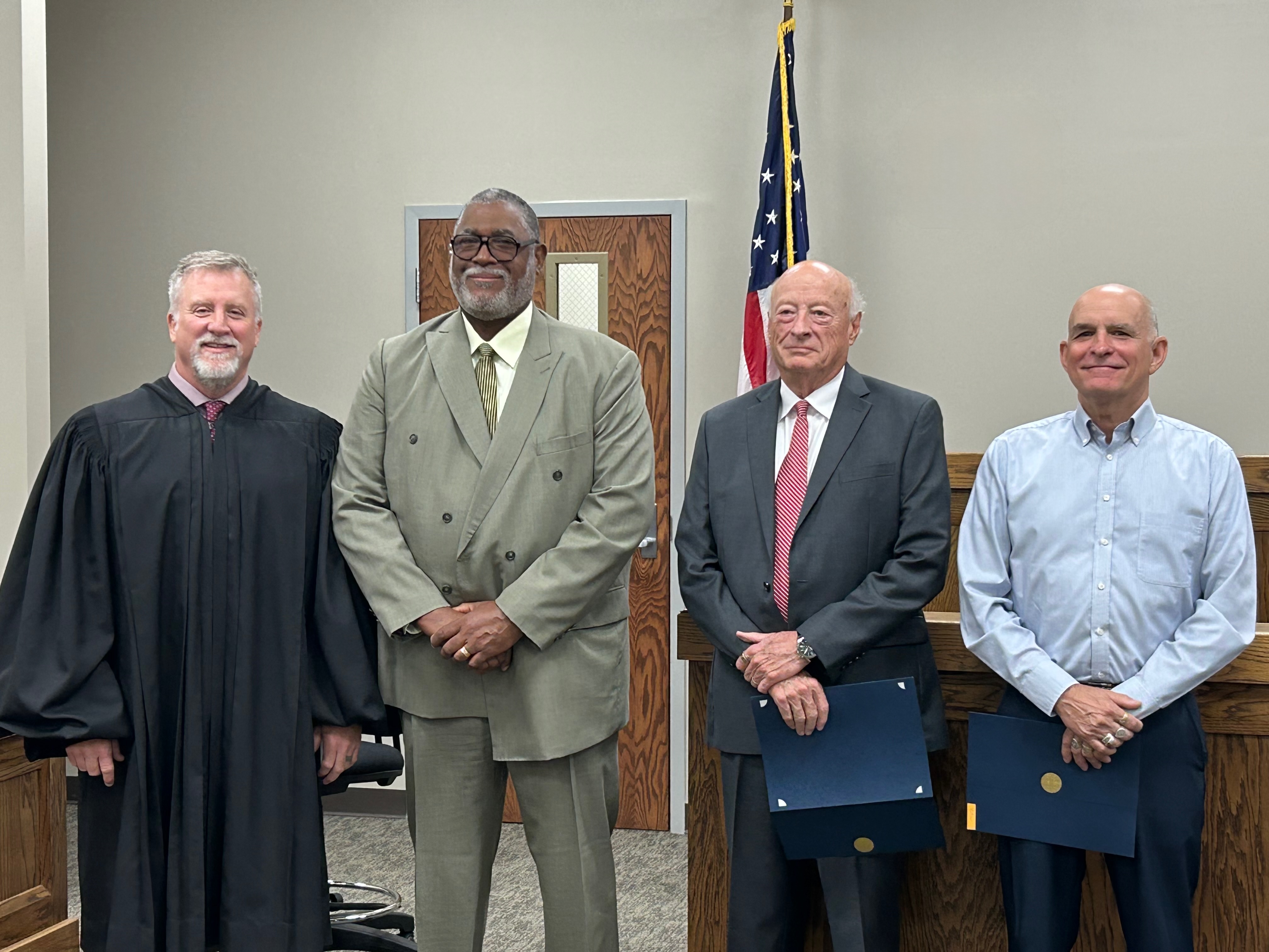 Formal group portrait of Judge M. O. Eckel III with the three founding Veterans Court Board members: David Bitzer, Dondi O. Albritton, and J. Houston Gordon
